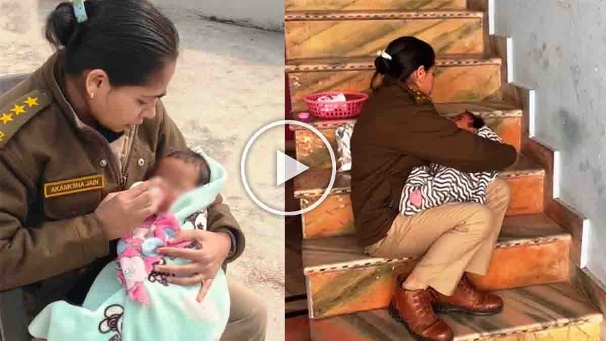 A woman police officer feeds and comforts an abandoned infant during a raid on an illegal liquor den in Madhya Pradesh