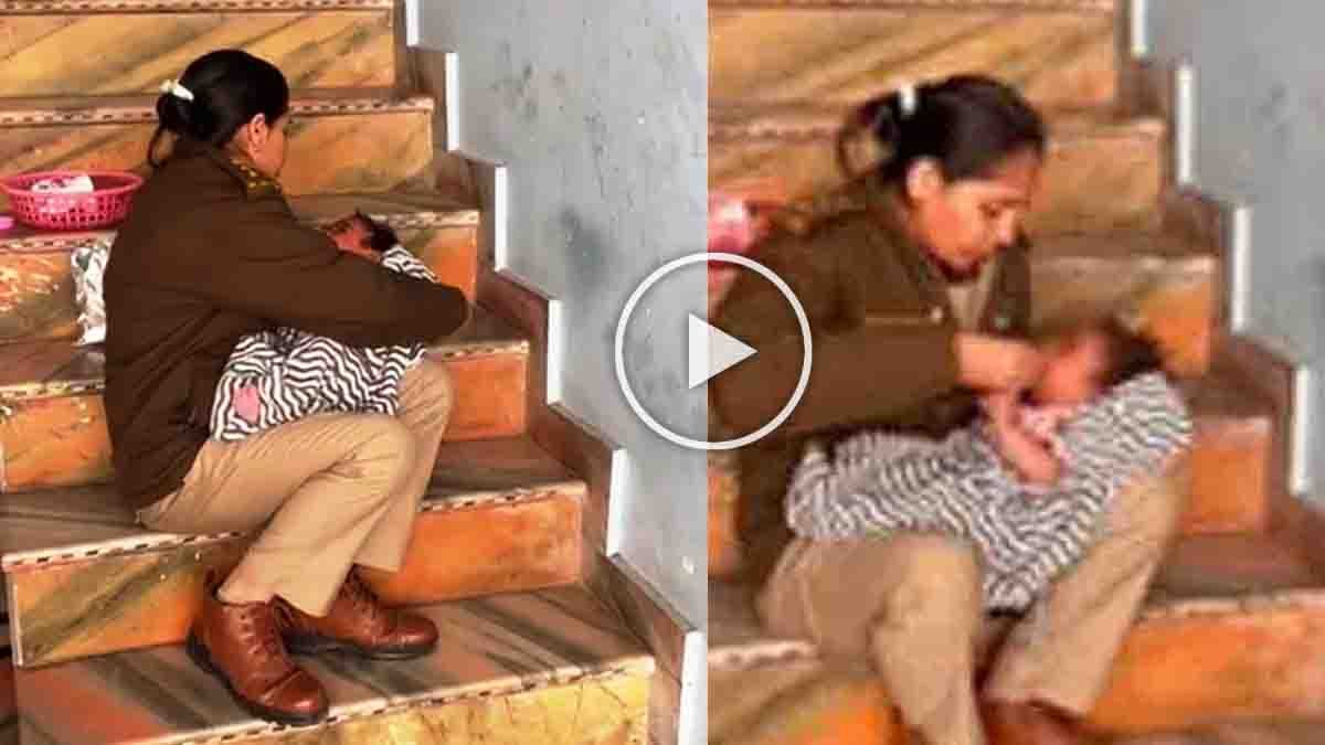 A woman police officer feeds and comforts an abandoned infant during a raid on an illegal liquor den in Madhya Pradesh