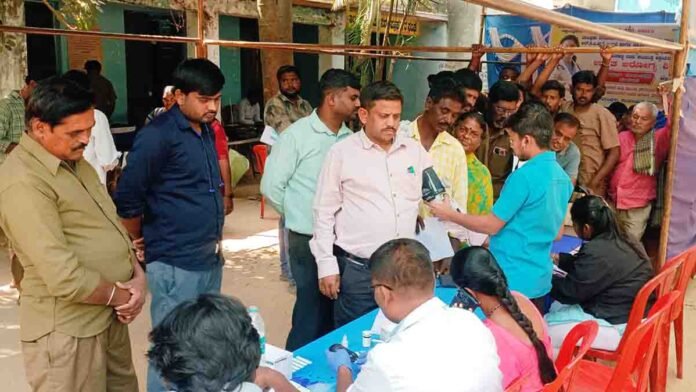 Doctors providing free checkups at a Health Camp in Gudibande, Karnataka
