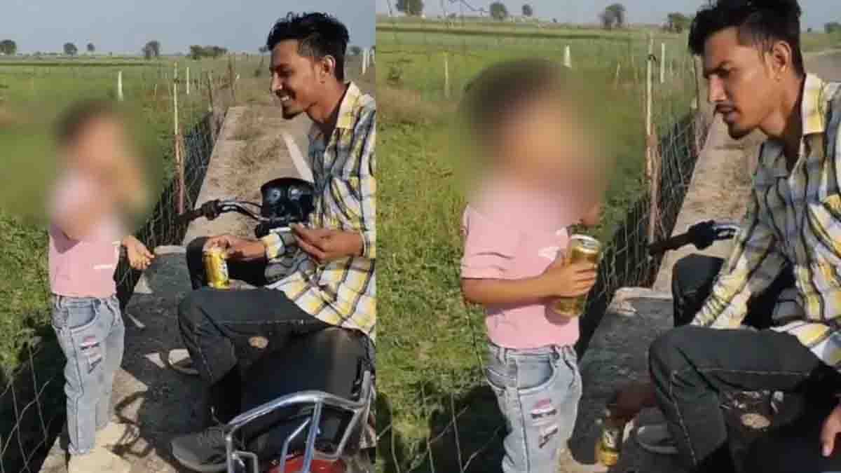 A disturbing viral video shows a man offering a cigarette to a small child while sitting on a motorcycle in Rajasthan.