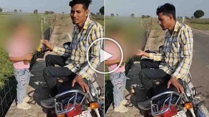 A disturbing viral video shows a man offering a cigarette to a small child while sitting on a motorcycle in Rajasthan.