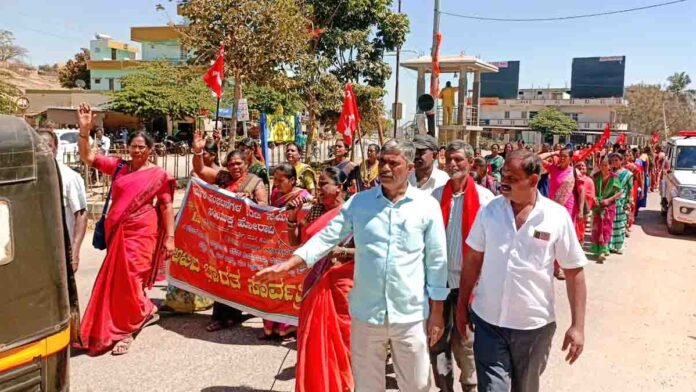 Labour unions and CPM leaders lead a massive protest march in Gudibande opposing the Central Government’s anti-worker policies.