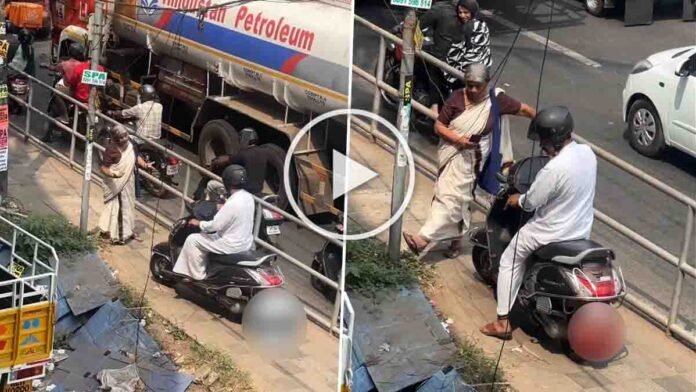 Kozhikode viral video showing elderly woman stopping biker riding on pedestrian footpath at Eranhipalam signal