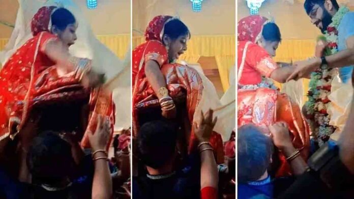 Viral video showing a bride crying in fear after being lifted high during a wedding ceremony
