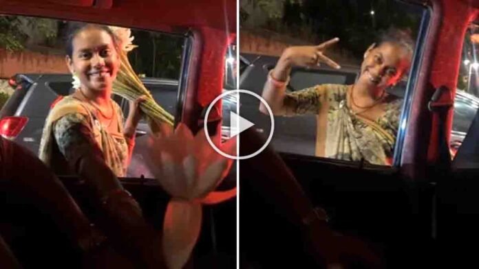 Viral video shows young flower seller smiling at traffic signal and offering flowers with kindness and humanity