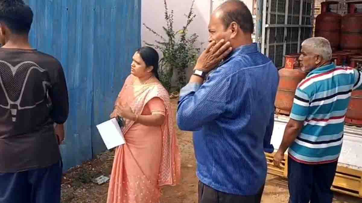 Gas Cylinder Raid officials seizing illegal LPG cylinders in Gudibande residential area