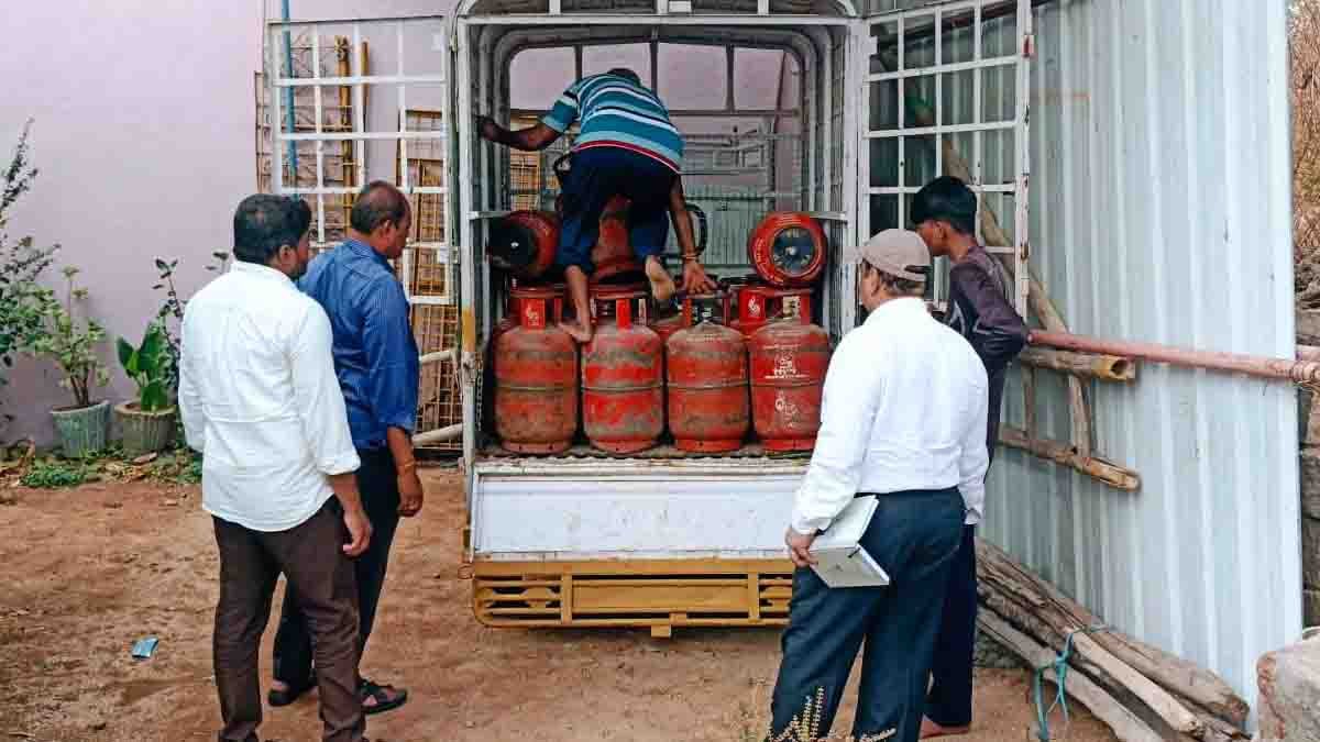 Gas Cylinder Raid officials seizing illegal LPG cylinders in Gudibande residential area