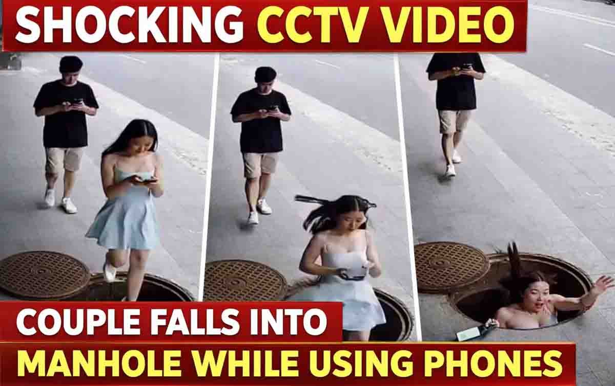 CCTV video captures young man and woman falling into open manhole while walking and looking at smartphones