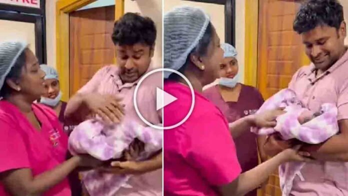First time father holding his newborn baby with trembling hands in hospital while doctor guides him - Viral Video