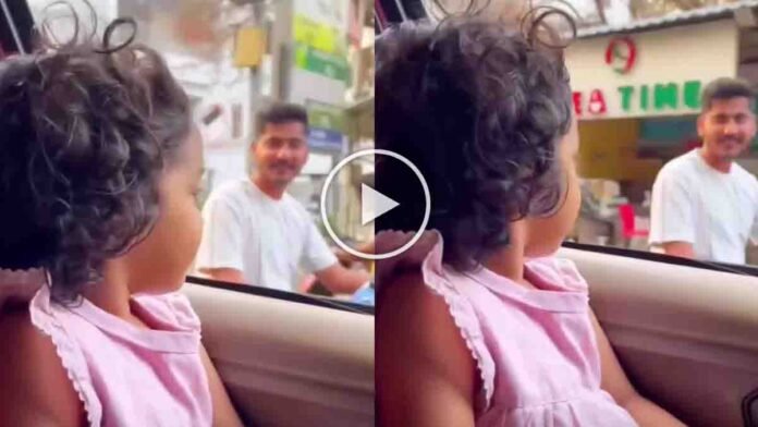 Little girl reminding biker about helmet safety on road