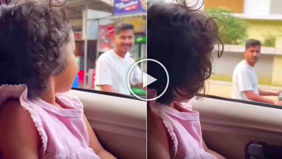 Little girl reminding biker about helmet safety on road