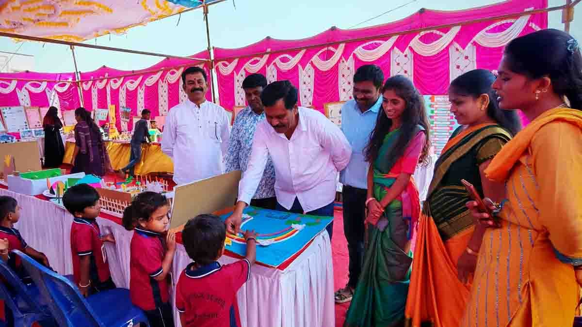 Students presenting creative science models during the Science and Art Exhibition at New Public School in Gudibande