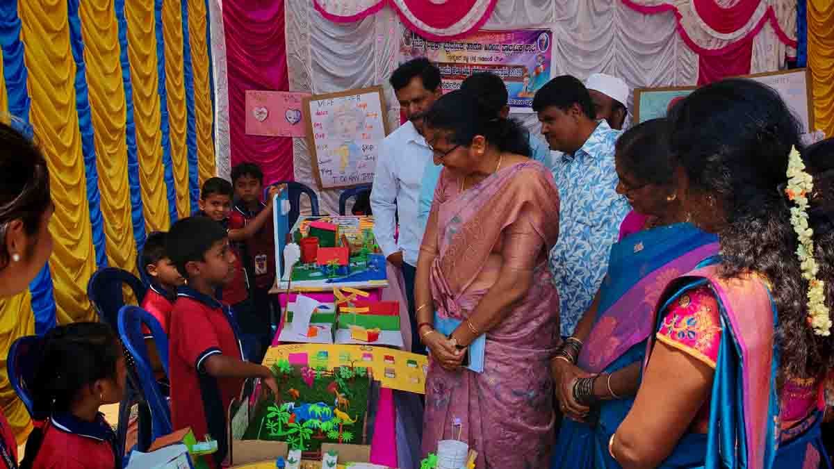 Students presenting creative science models during the Science and Art Exhibition at New Public School in Gudibande