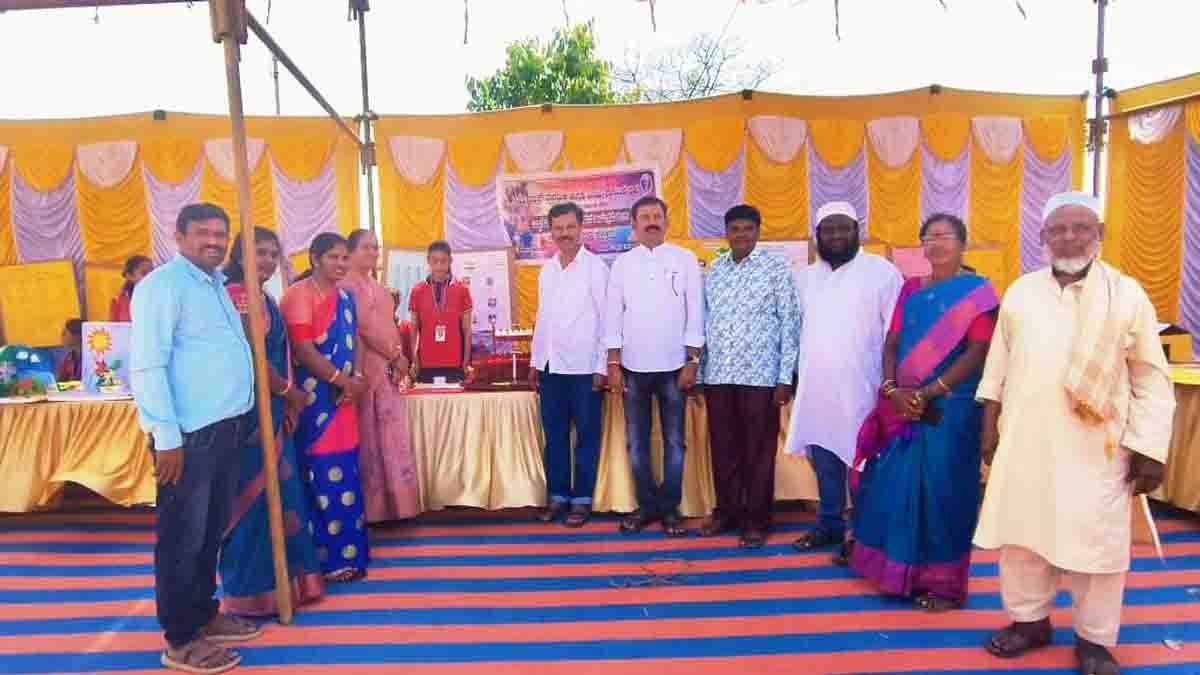 Students presenting creative science models during the Science and Art Exhibition at New Public School in Gudibande