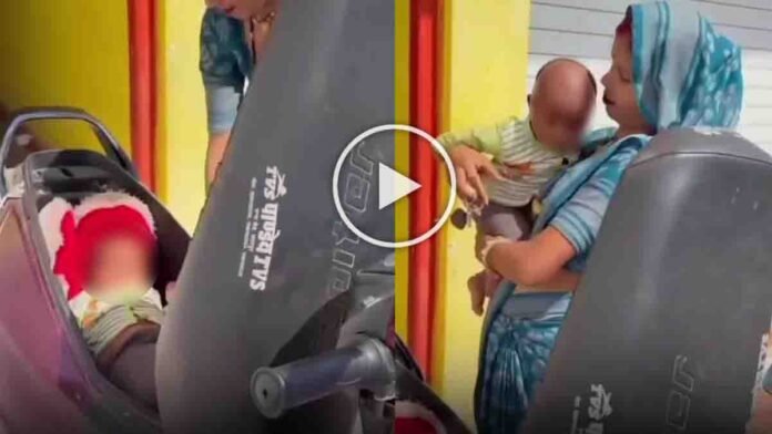viral video woman placing baby inside scooter diggi storage compartment shocking incident