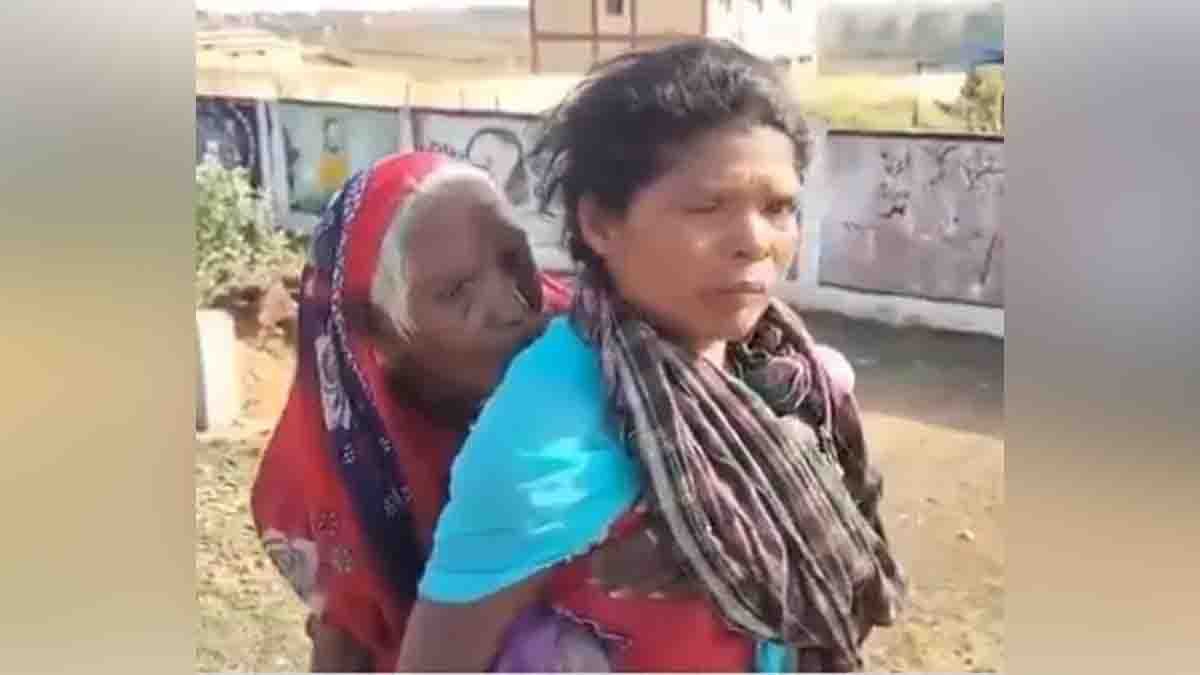 Chhattisgarh tribal woman carrying her elderly mother-in-law on her back to collect pension money