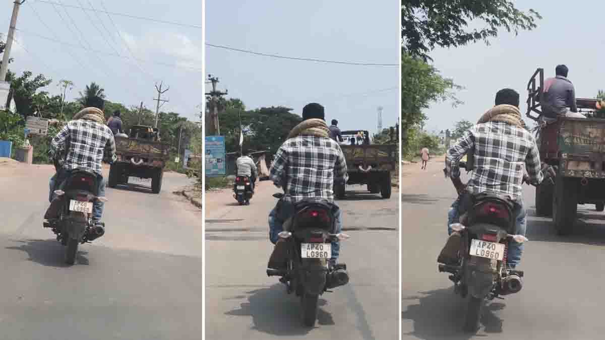 Young man performing a viral python bike stunt with a giant snake wrapped around his neck while riding a motorcycle