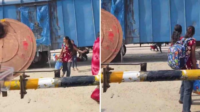Train Viral Video shows passengers dangerously crossing beneath a moving goods train at a railway station