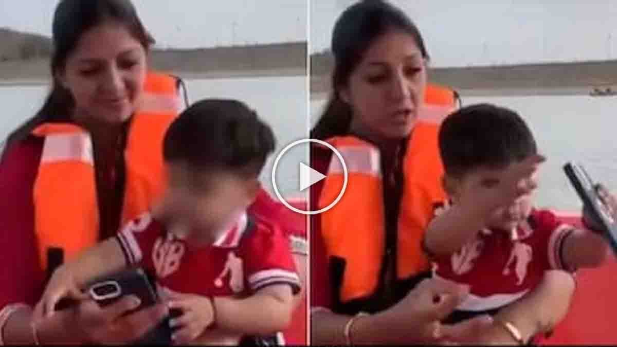 Funny video of a child throwing his mother's expensive iPhone into a lake during a boat ride