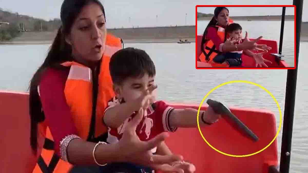 Funny video of a child throwing his mother's expensive iPhone into a lake during a boat ride