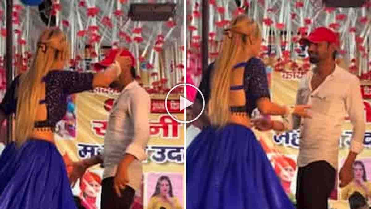 Female dancer slaps a man on stage after alleged inappropriate behavior during a public dance performance.