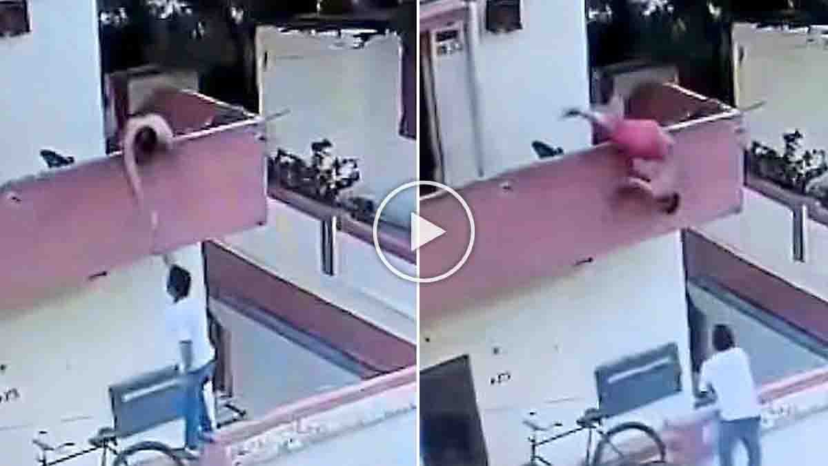 Ice Cream Viral Video showing a man falling from a first-floor balcony while reaching for ice cream from a street vendor below.