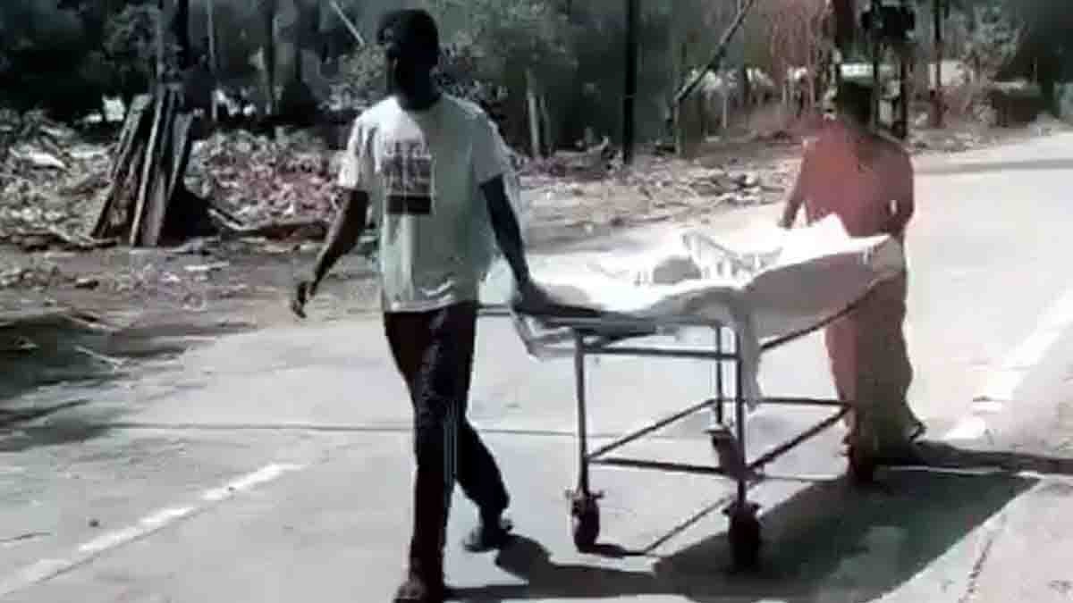 Indore Hospital Incident showing parents pushing their sick son on a stretcher after an ambulance was unavailable at a government hospital.