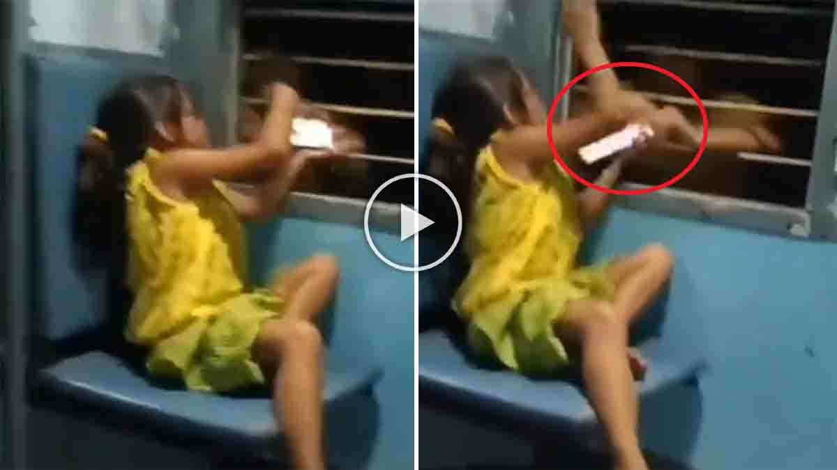 Train Viral Video showing a thief snatching a girl’s mobile phone through a train window