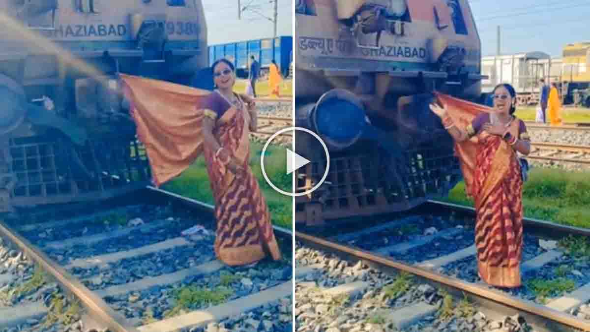 Woman Railway Track Viral Video sparks concern after a woman is seen dancing on a railway track near a stationary train.