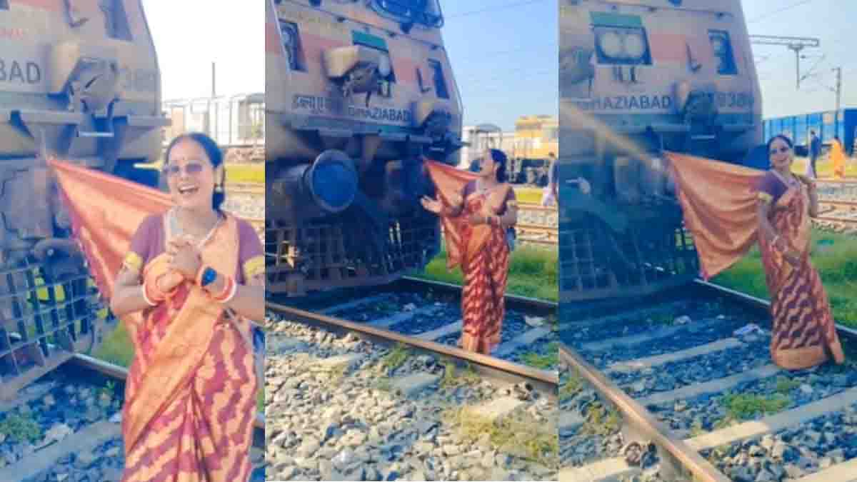 Woman Railway Track Viral Video sparks concern after a woman is seen dancing on a railway track near a stationary train.
