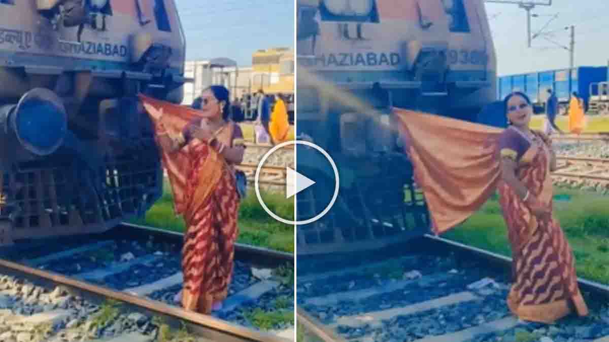 Woman Railway Track Viral Video sparks concern after a woman is seen dancing on a railway track near a stationary train.